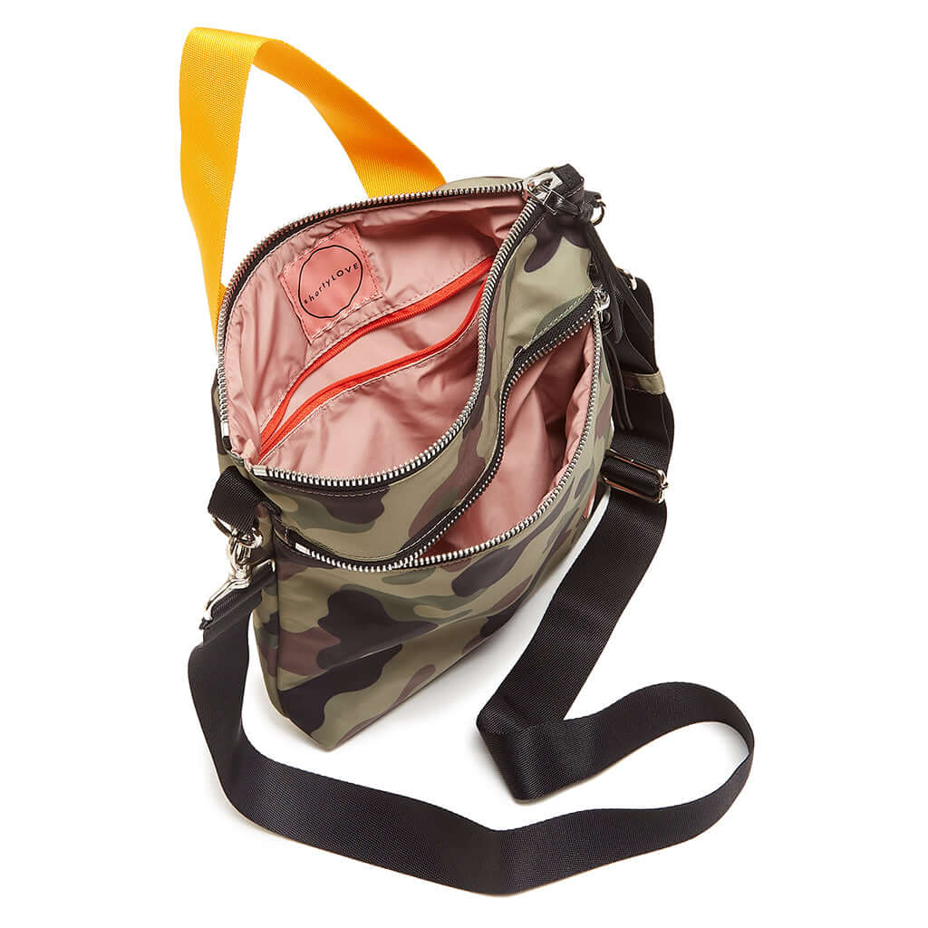 shortyLOVE amuse medium sized crossbody bag in green camo; top-down view showing interior pink lining against white background.