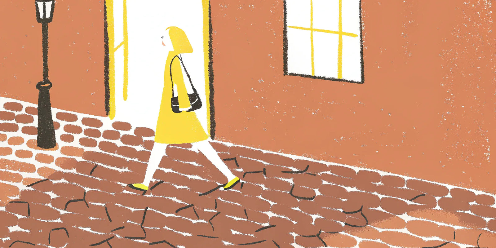 Woman in a yellow dress styles a black phone crossbody bag on a cobblestone street.