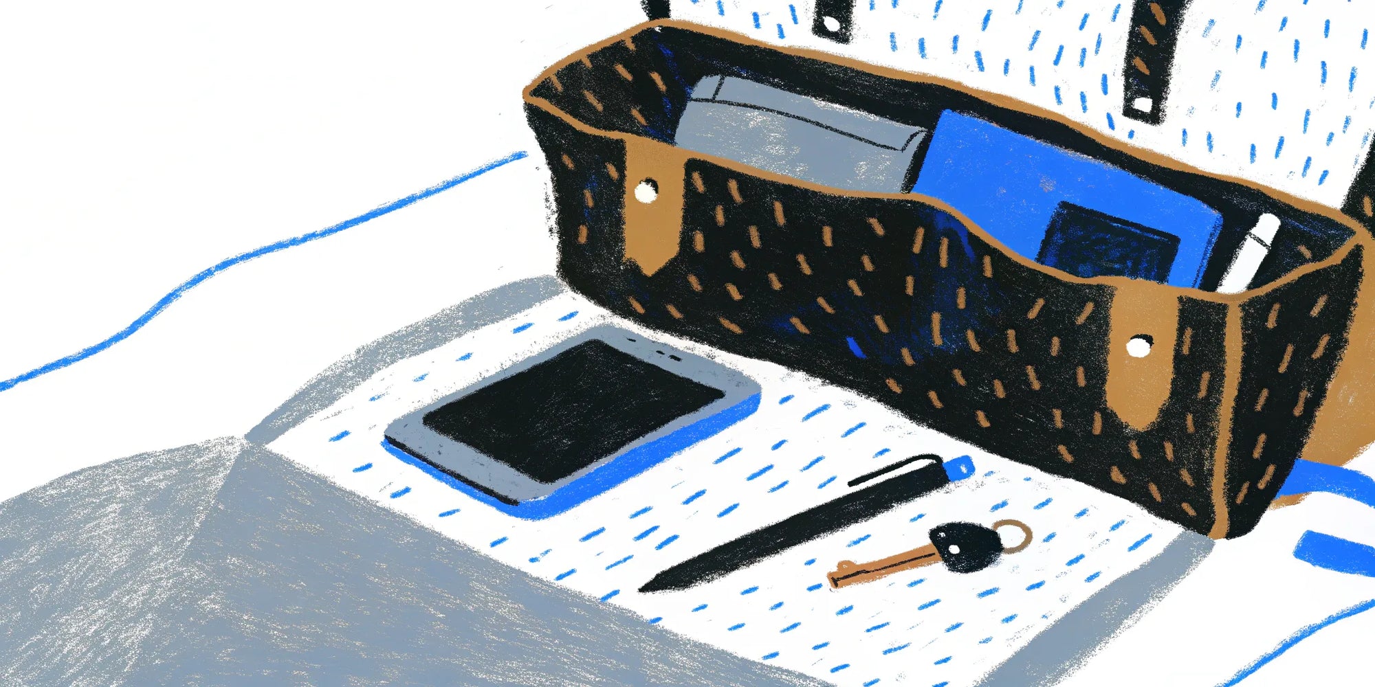 Organized tote bag with tablet, pen, keys, and notebooks.