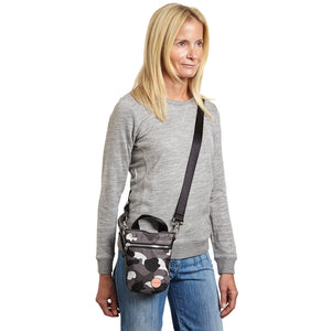 shortyLOVE shorthand small crossbody bag in grey camo; on model in grey sweatshirt and jeans against white background.