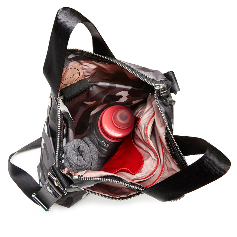 shortyLOVE wonder large crossbody/messenger bag in grey camo; top-down view showing interior blush lining against white background.