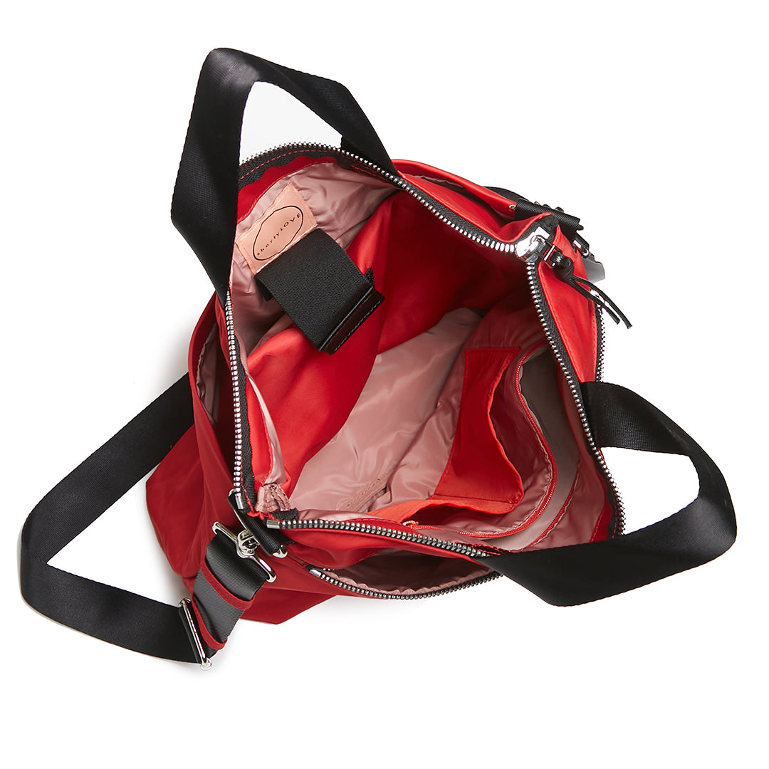 shortyLOVE wonder large crossbody/messenger bag in red; top-down view showing interior blush lining against white background.