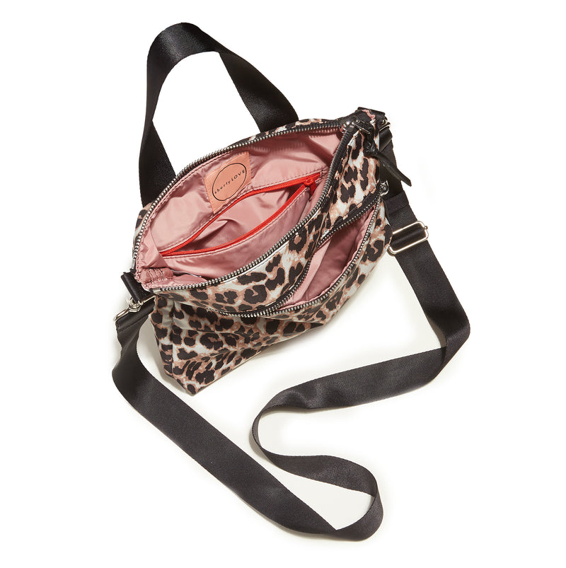 shortyLOVE amuse medium sized crossbody bag in leopard; top-down view showing interior blush/red lining against white background.