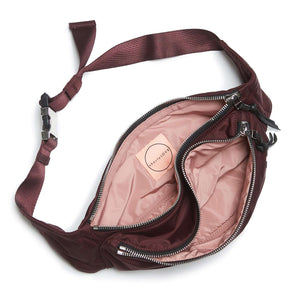 shortyLOVE arcade belt bag in burgundy; top-down view showing interior pink lining against white background.