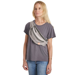 shortyLOVE arcade belt bag in grey; on model worn crossbody in grey t-shirt and jeans against white background.