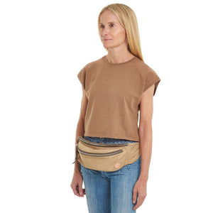 shortyLOVE arcade belt bag in khaki; on model worn crossbody in mocha t-shirt and jeans against white background.