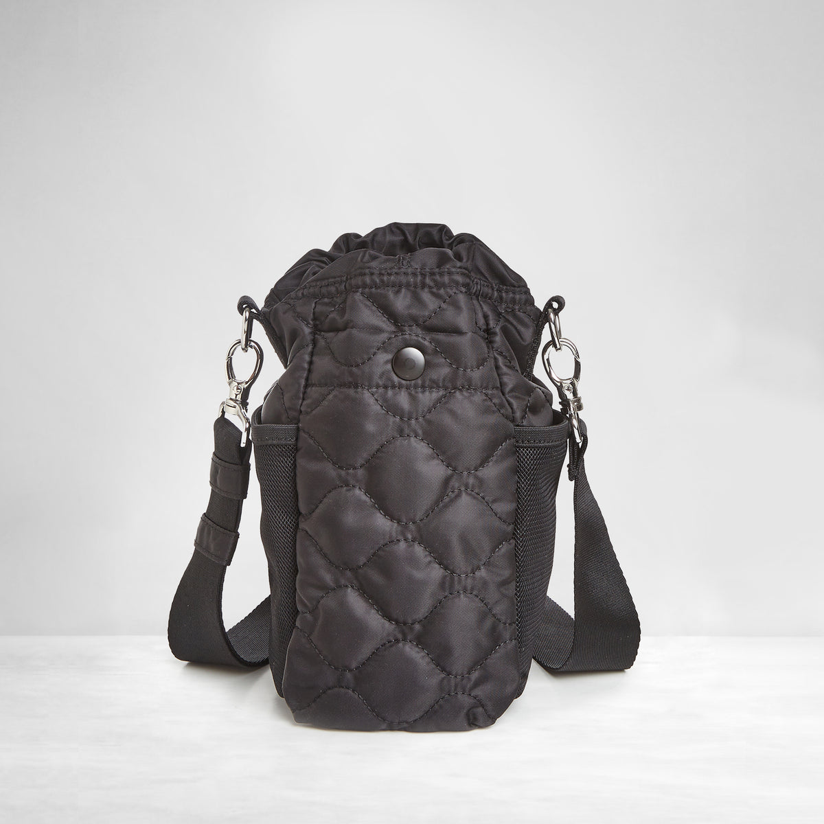 shortyLOVE bea sling bag in black; back view against grey background.