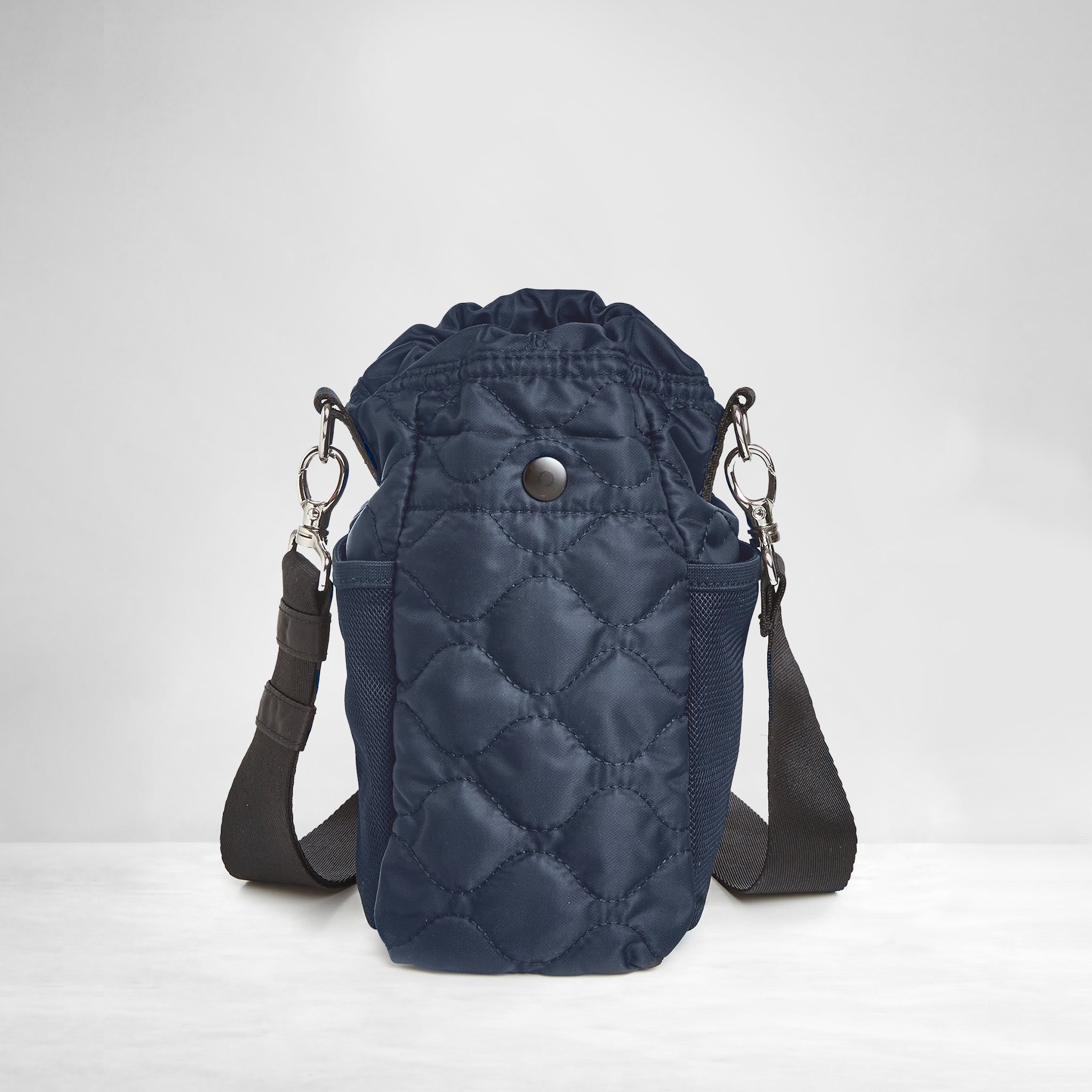 shortyLOVE bea sling bag in midnight; back view against grey background.