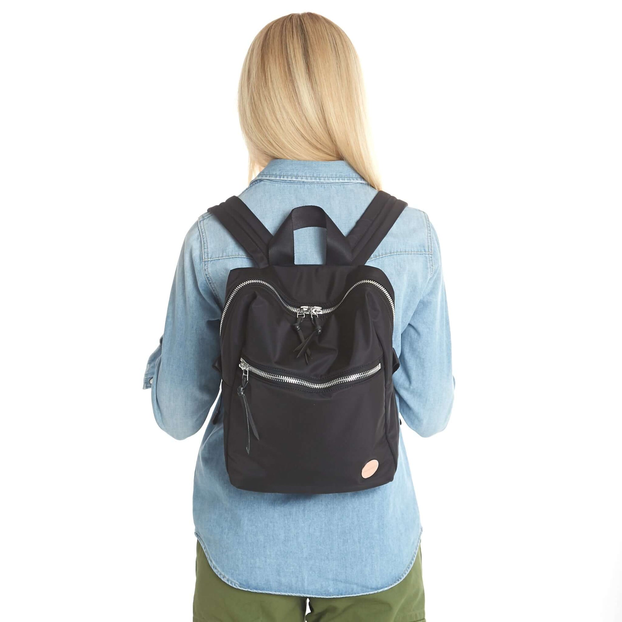 shortyLOVE ace small backpack in black; on back of model in jean shirt and olive pants against white background.