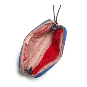 shortyLOVE jetty clutch/wallet in blue camo; top-down view showing interior blush lining against white background.