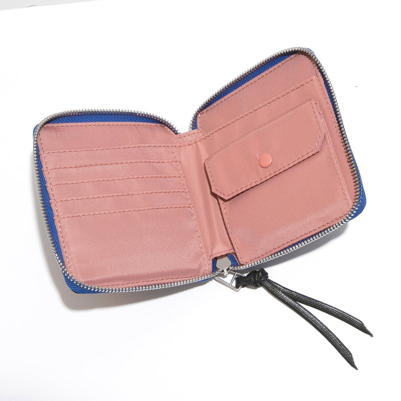 shortyLOVE merchant clutch/wallet in blue camo; top-down view showing interior blush lining against white background.