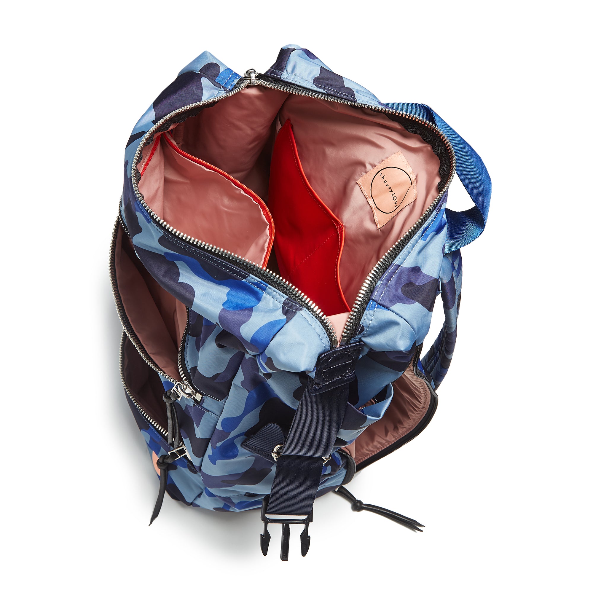 shortyLOVE boxer backpack in bluecamo; top-down view showing interior blush lining against white background.