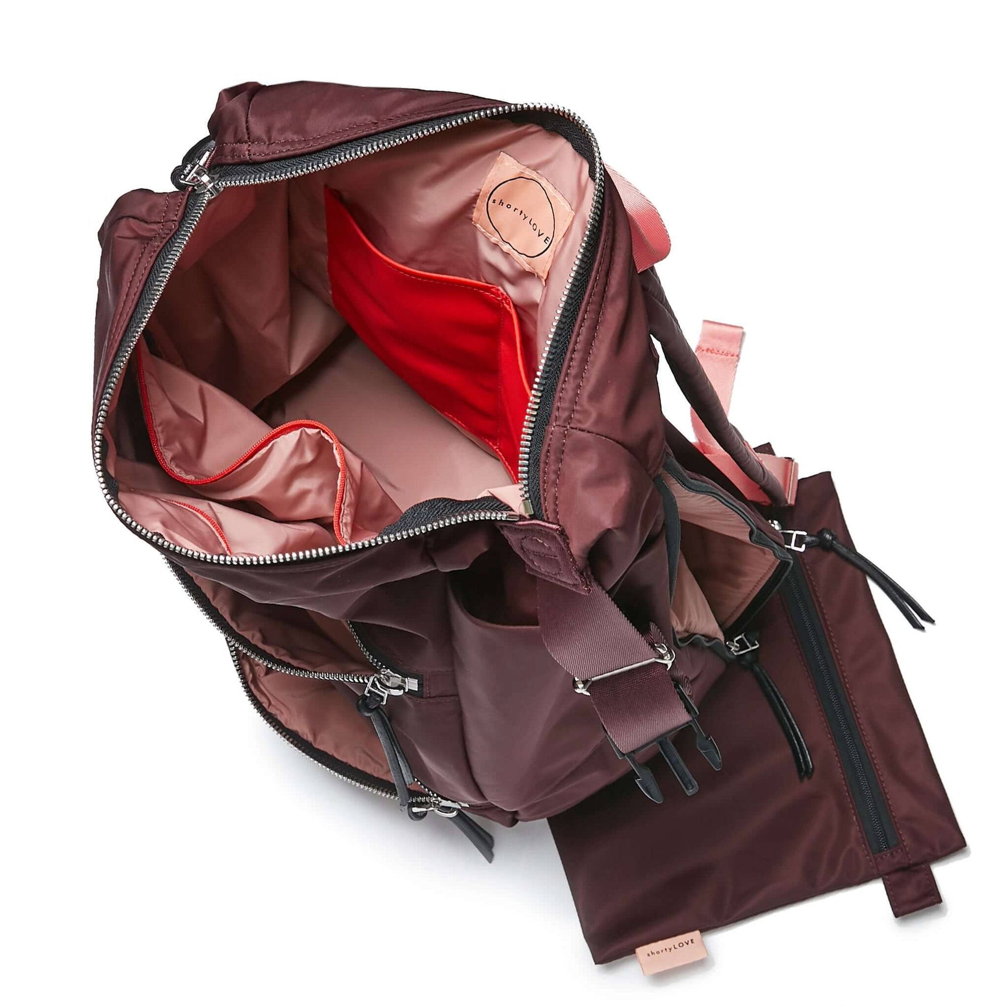 shortyLOVE boxer backpack in burgundy; top-down view showing interior pink lining against white background.