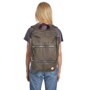 shortyLOVE boxer backpack in mocha; on model on back in grey t-shirt and jeans against white background.
