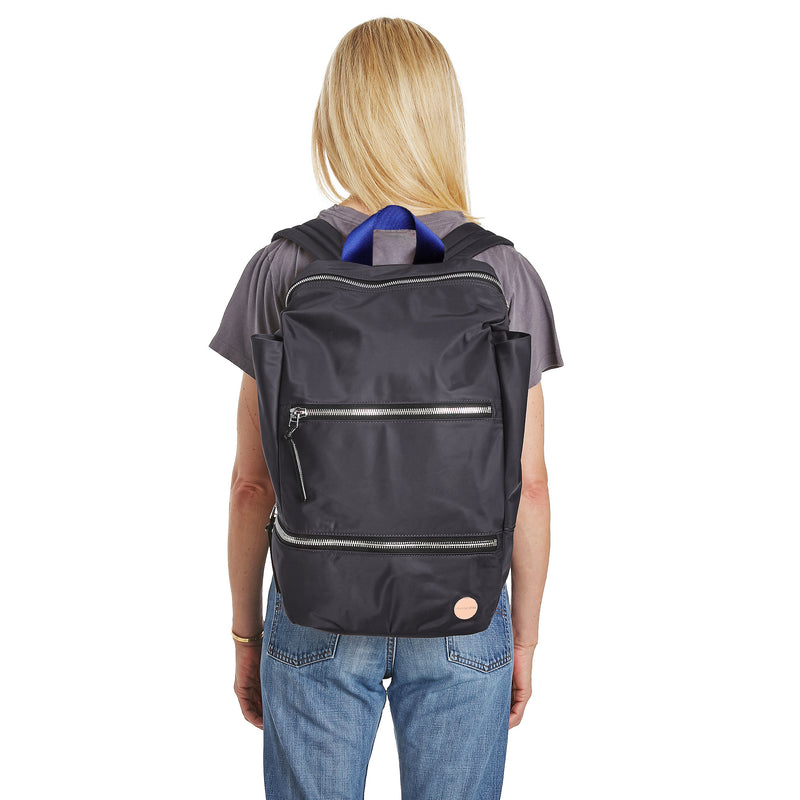 shortyLOVE boxer backpack in charcoal; on model over shoulder in grey t-shirt and jeans against white background.