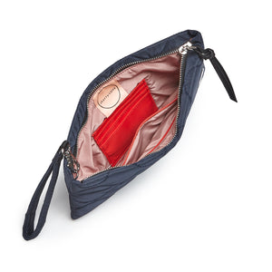 shortyLOVE cleo wristlet clutch in midnight; top-down view showing interior blush lining against white background.