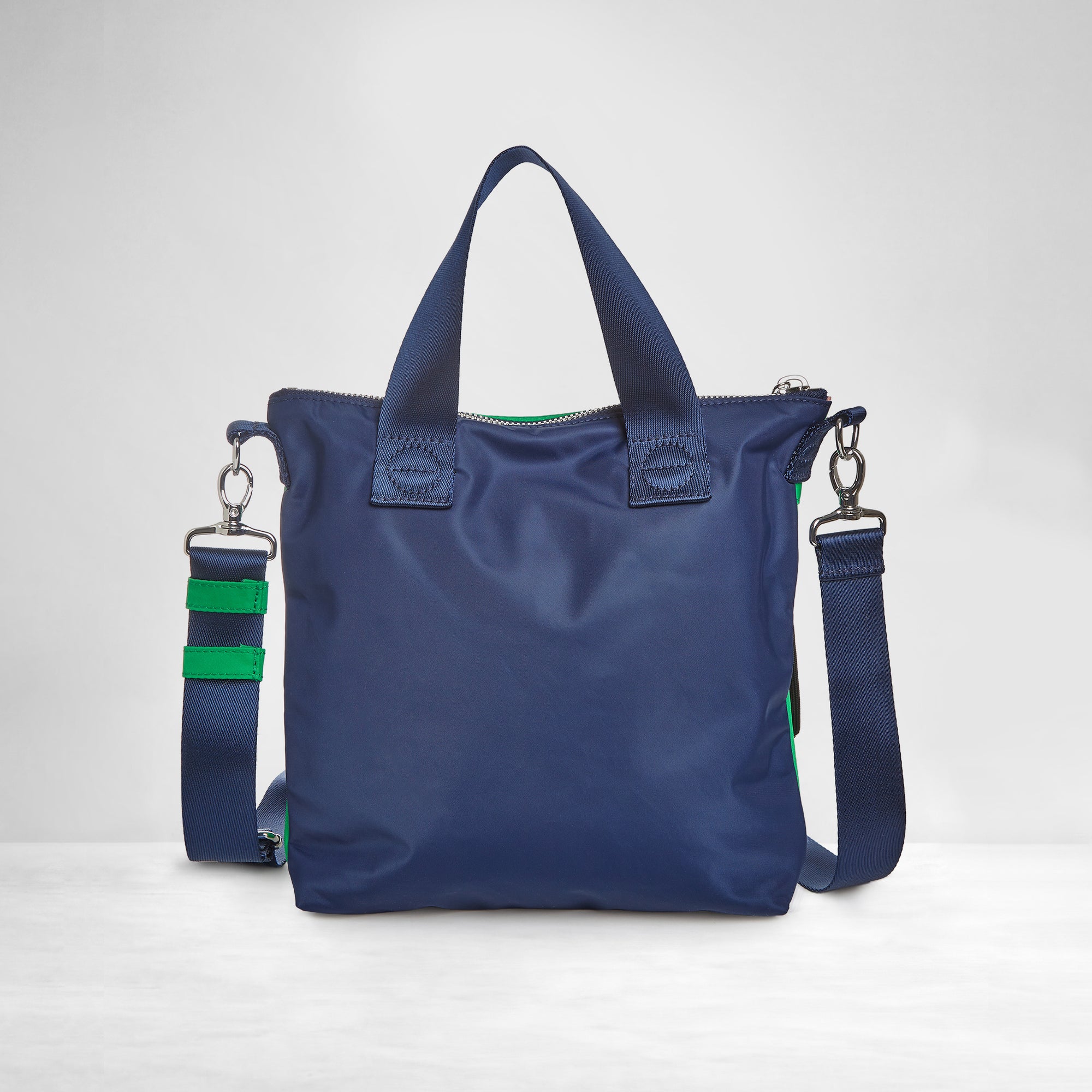 shortyLOVE amuse medium sized crossbody bag in grass green/navy; back view showing against white background.