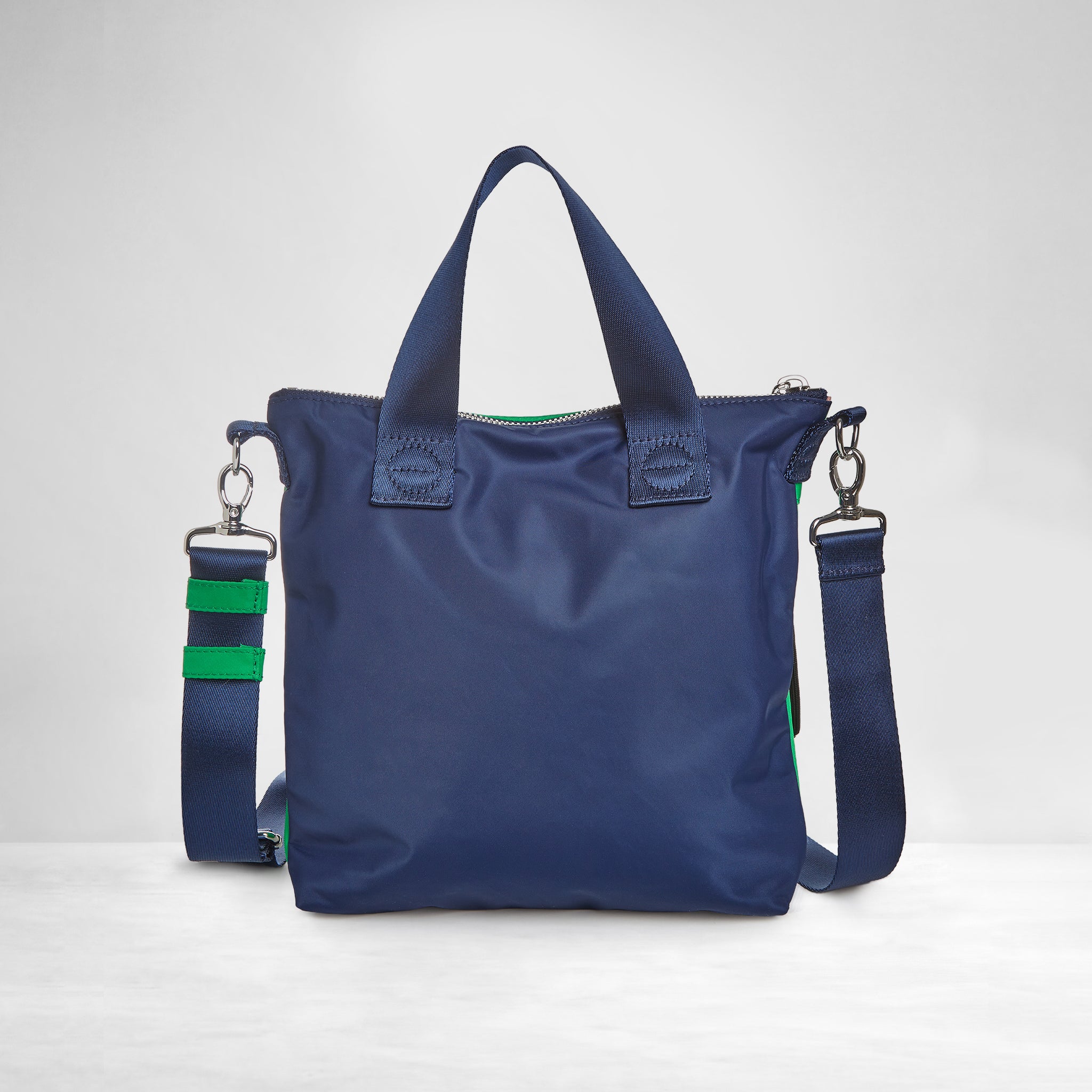 shortyLOVE amuse medium sized crossbody bag in grass green/navy; back view showing against white background.