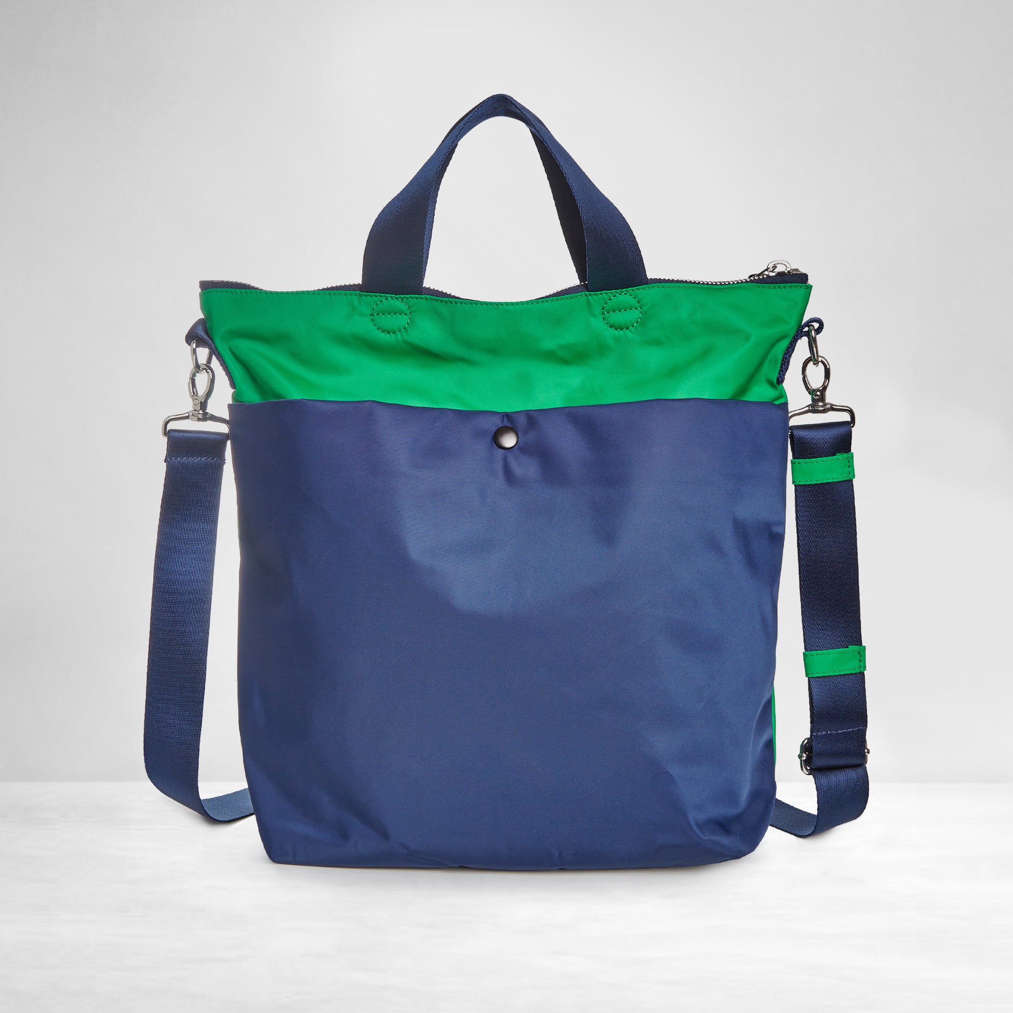 shortyLOVE wonder large crossbody/messenger bag in grass green/navy; back view against white background.