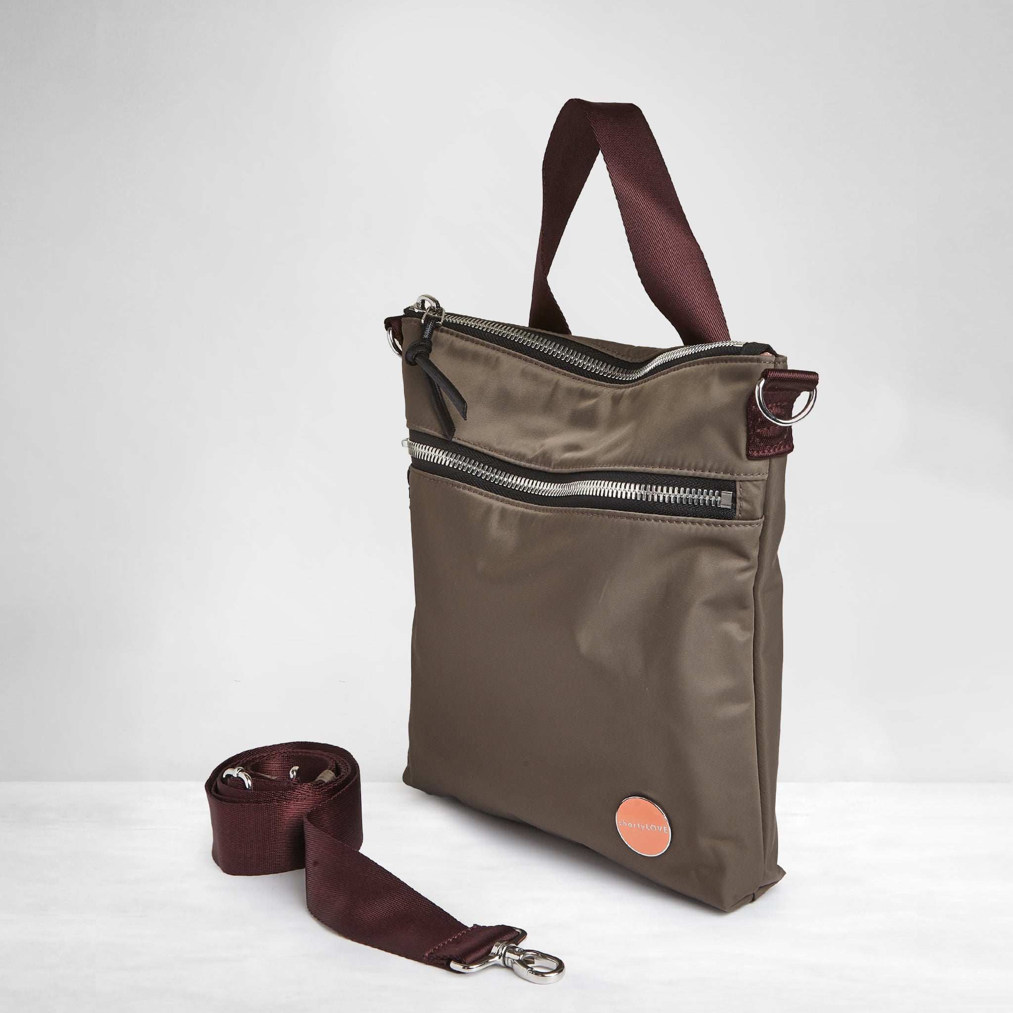 shortyLOVE amuse medium sized crossbody bag in mocha; side angle view against white background.