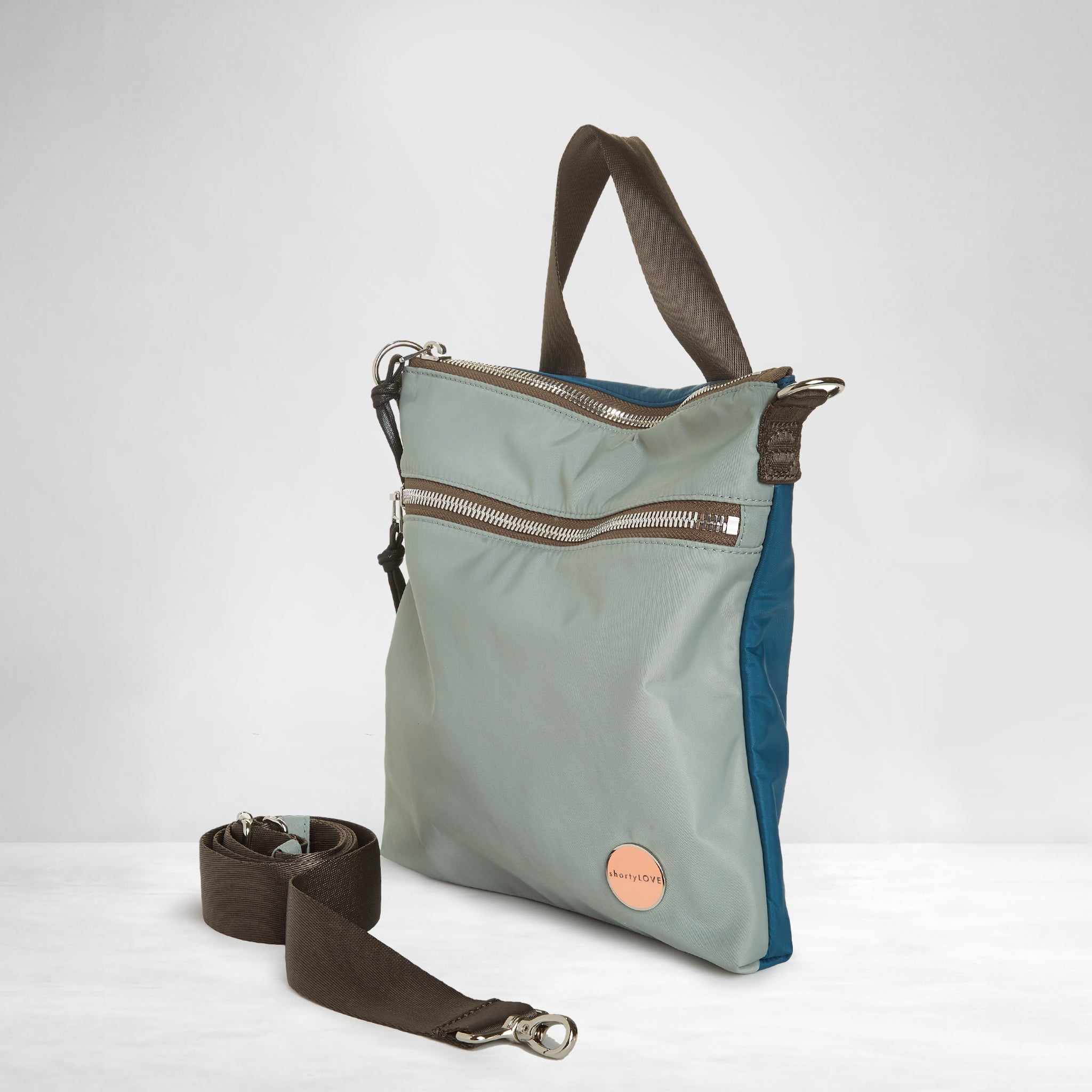 shortyLOVE amuse medium sized crossbody bag in slate/teal; side view against white background.