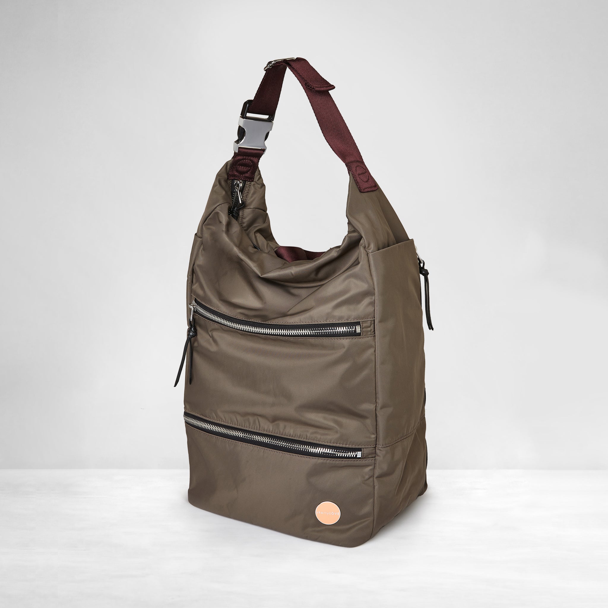 shortyLOVE boxer backpack in mocha; side angle view against white background.