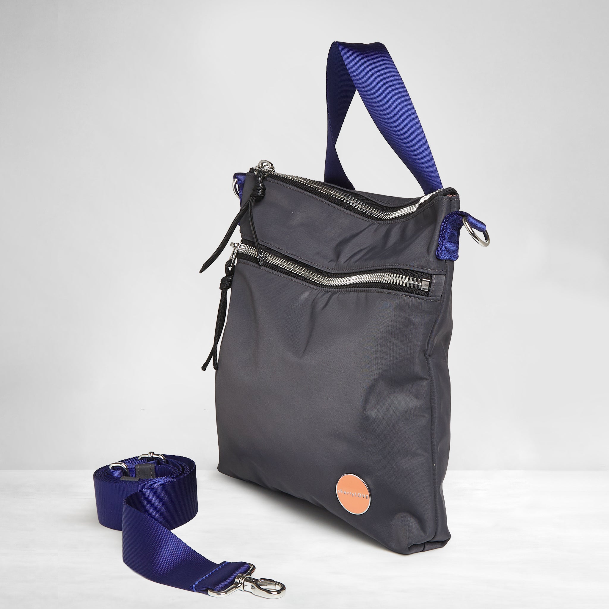 shortyLOVE amuse medium sized crossbody bag in charcoal; side angle view against white background.