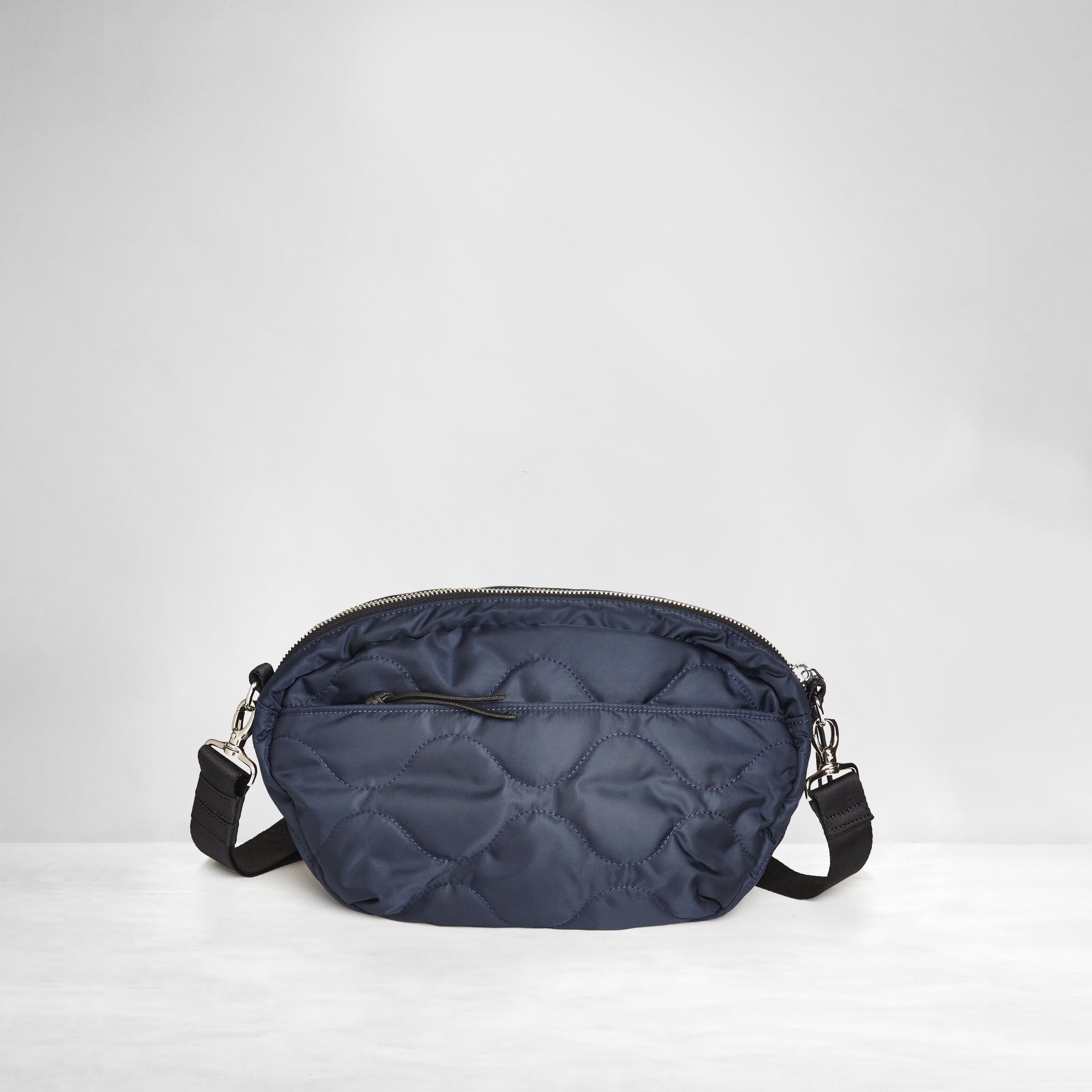 shortyLOVE cruiser medium crossbody bag in midnight; back view against white background.