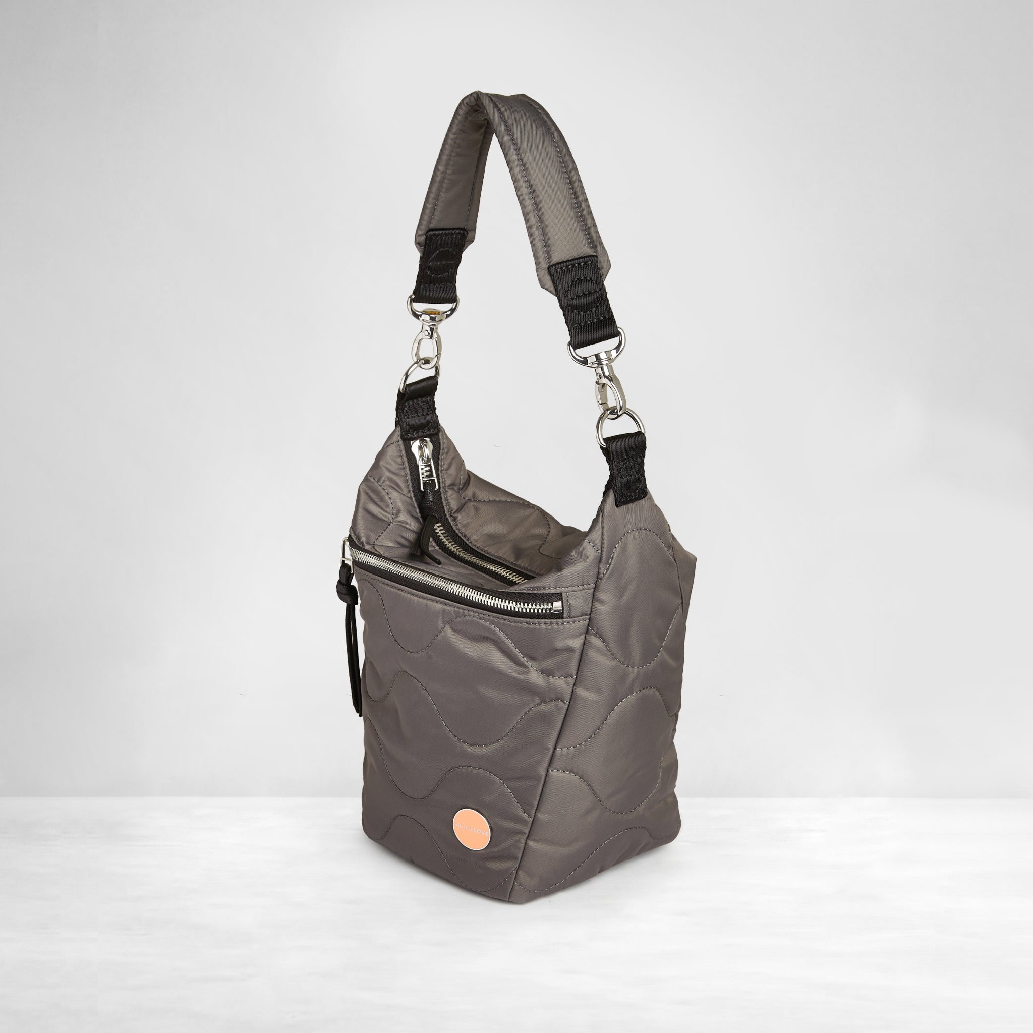 shortyLOVE marcel crossbody bucket bag in pewter; side view against white background.