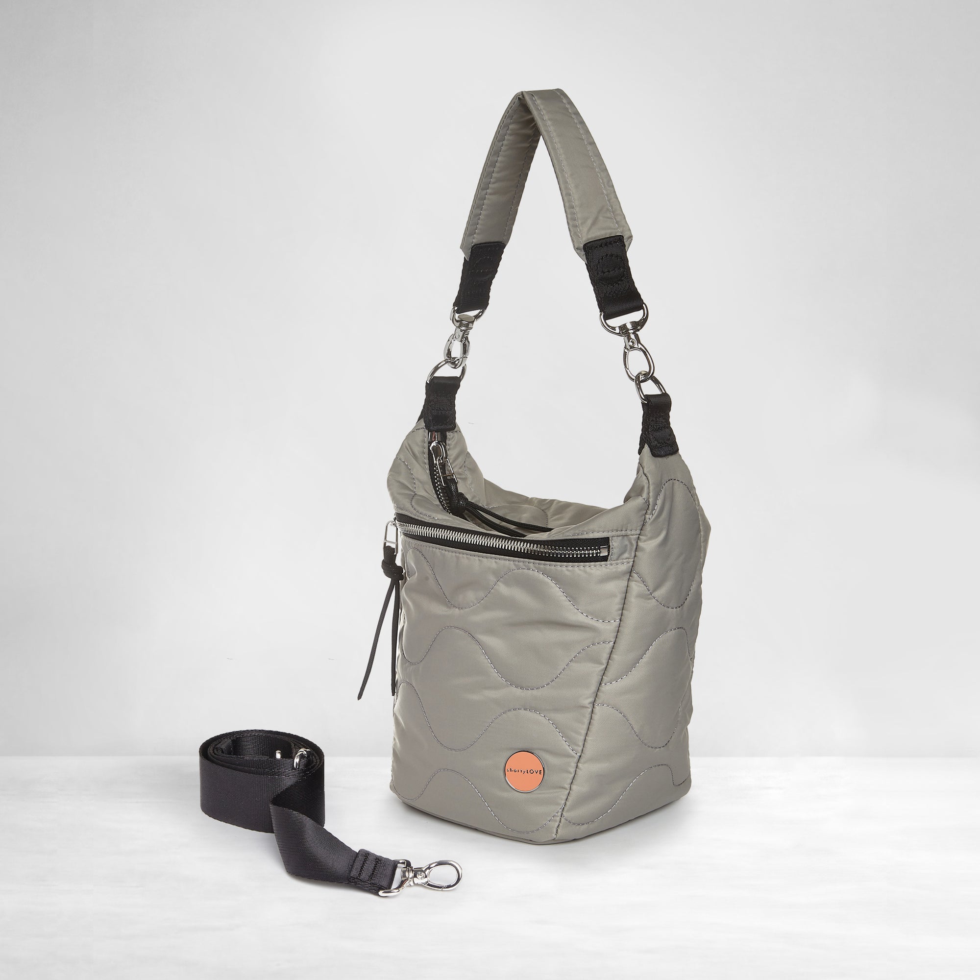 shortyLOVE marcel crossbody bucket bag in milky grey; side view against white background.