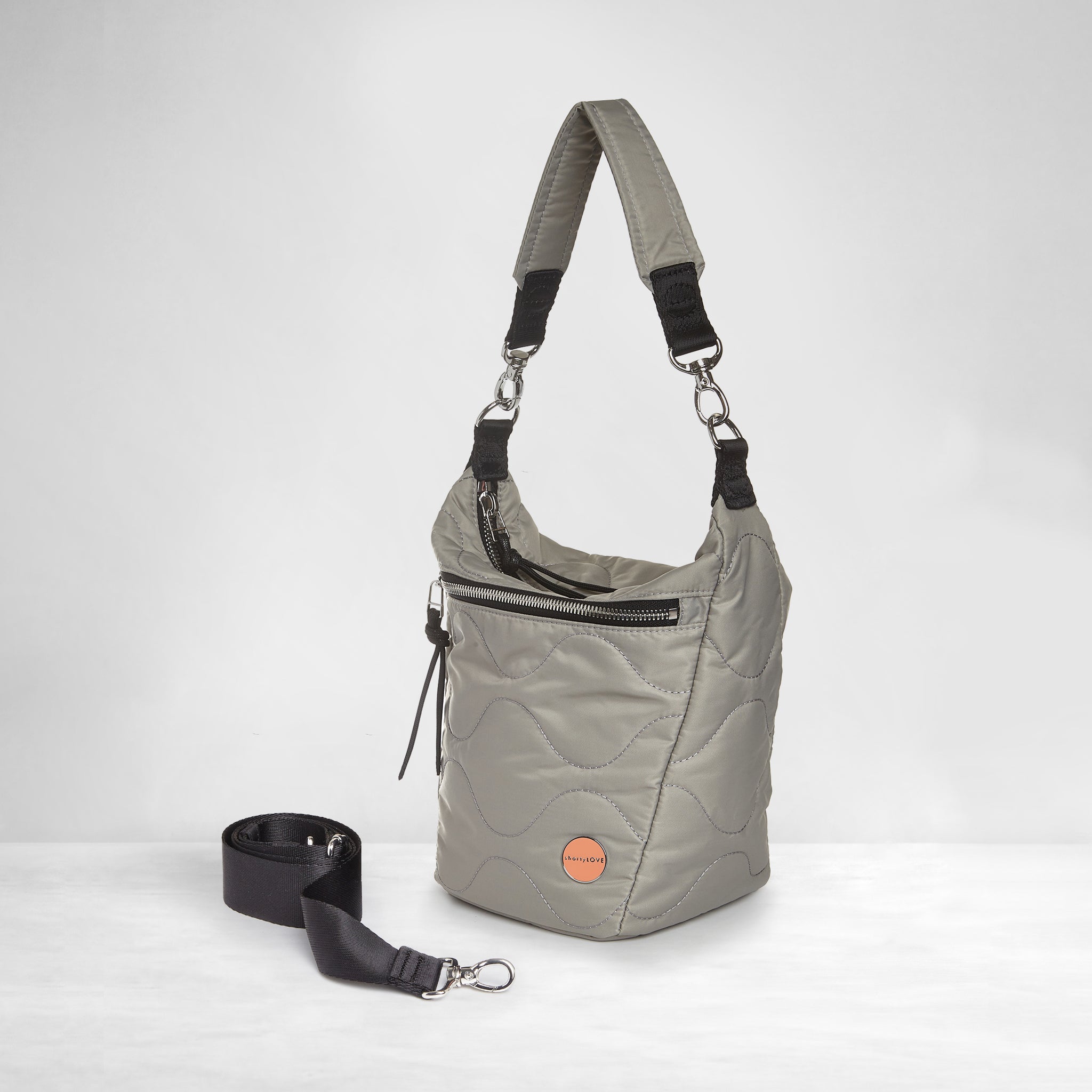 shortyLOVE marcel crossbody bucket bag in milky grey; side view against white background.