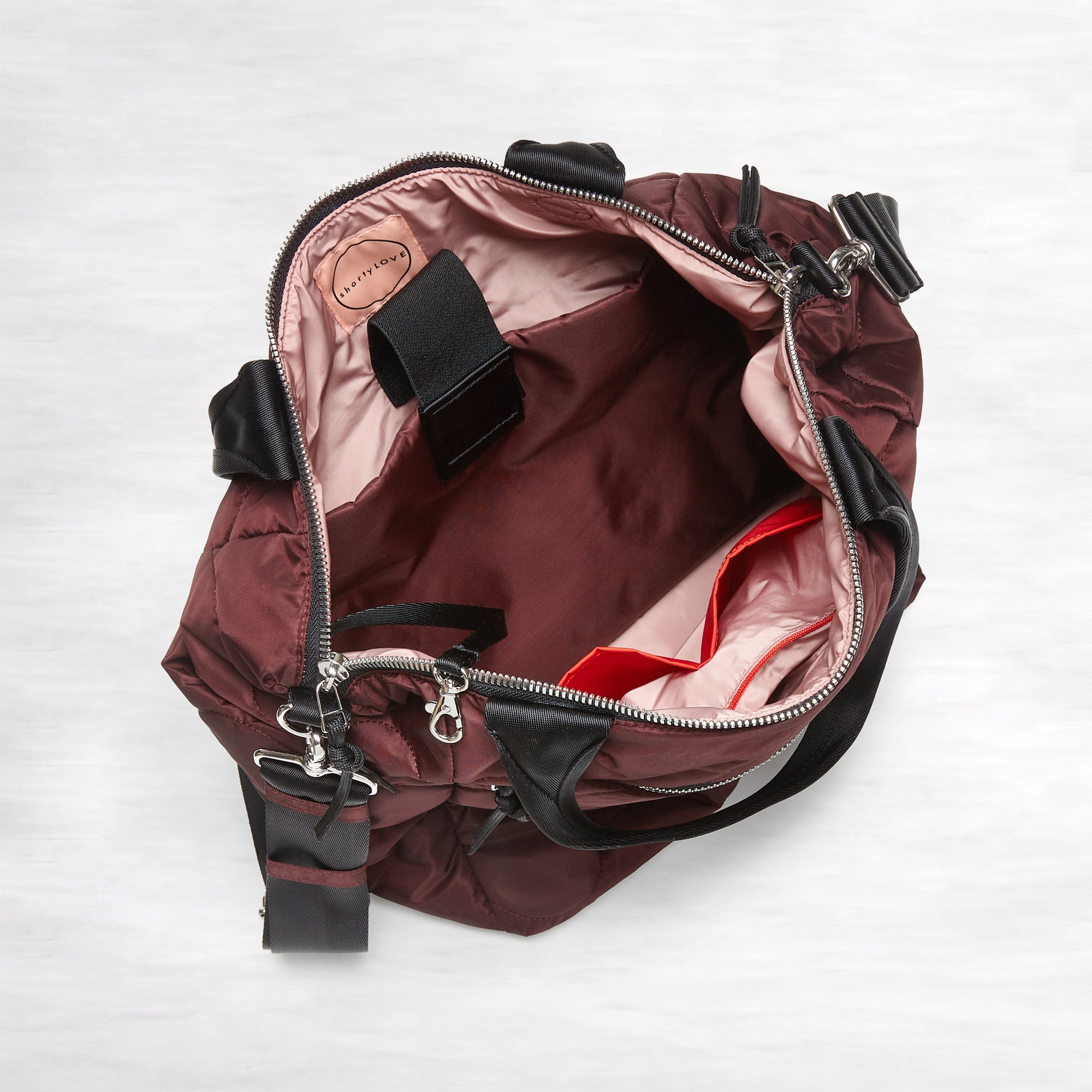 shortyLOVE ranger large quilted crossbody tote bag in bordeaux; top down view against white background