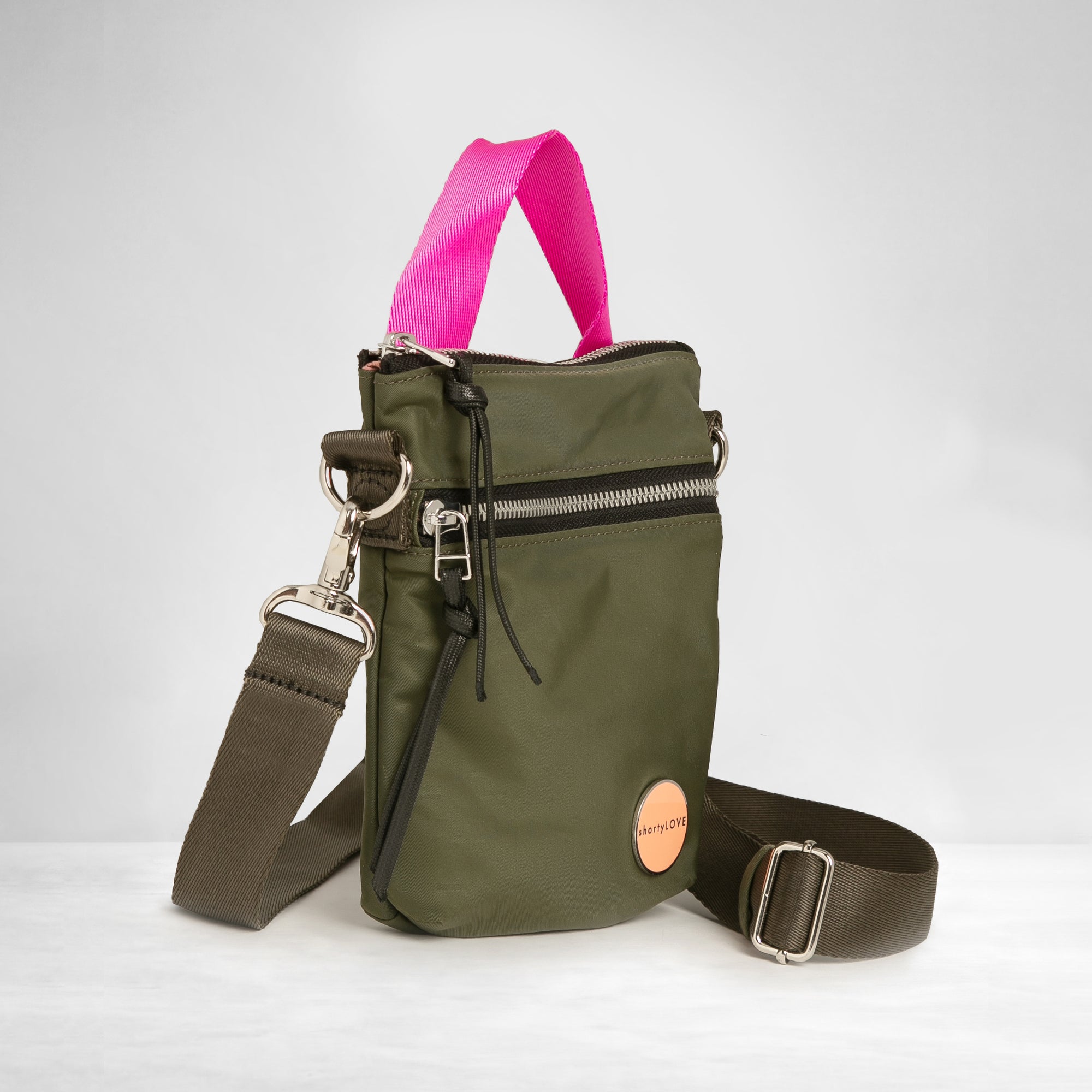 shortyLOVE shorthand crossbody phone bag in army green; side angle view against white background.