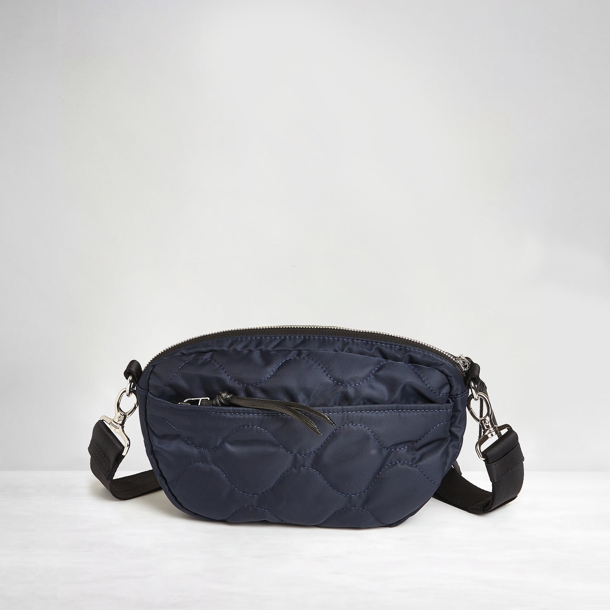 shortyLOVE small cruiser small crossbody bag in midnight; back view against white background.