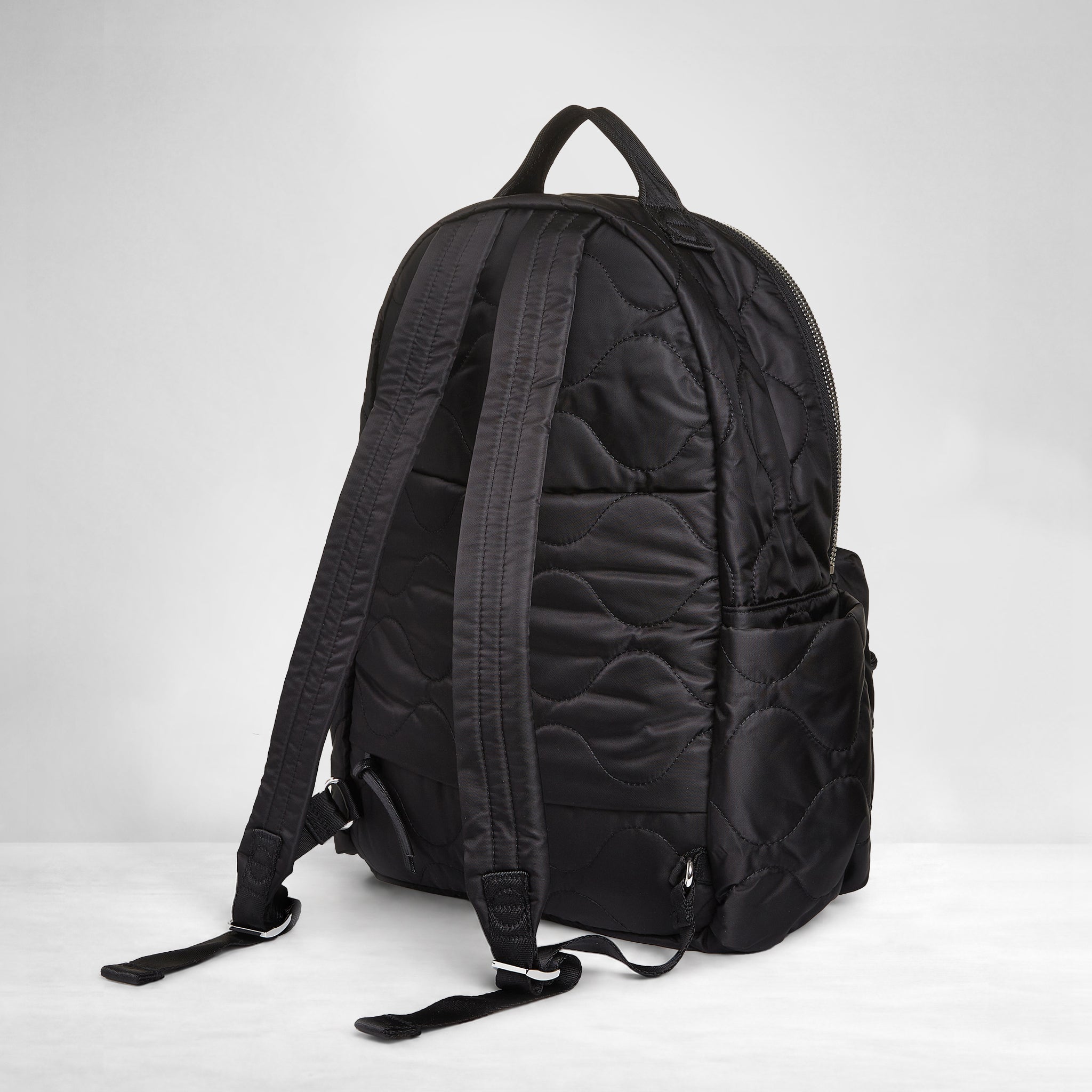 shortyLOVE tate backpack in black; back view against white background.