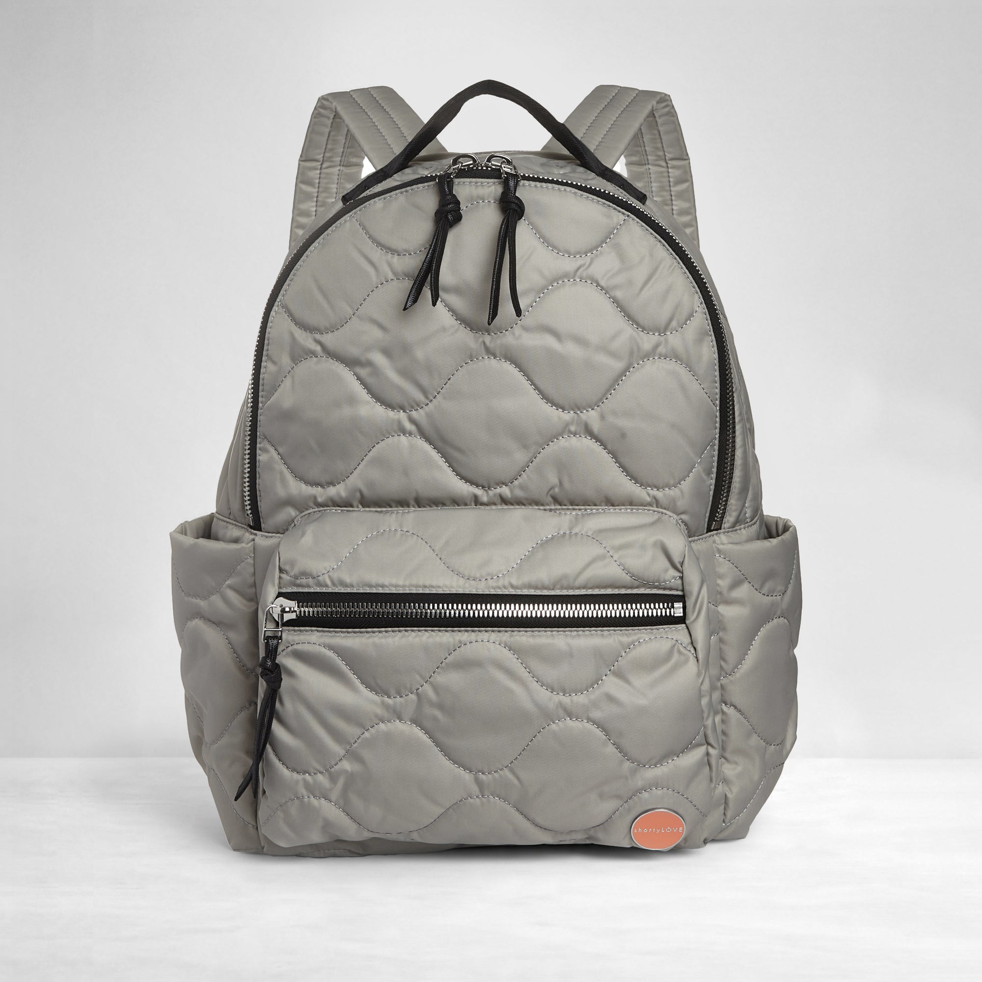 shortyLOVE tate backpack in milky grey; front view against white background.