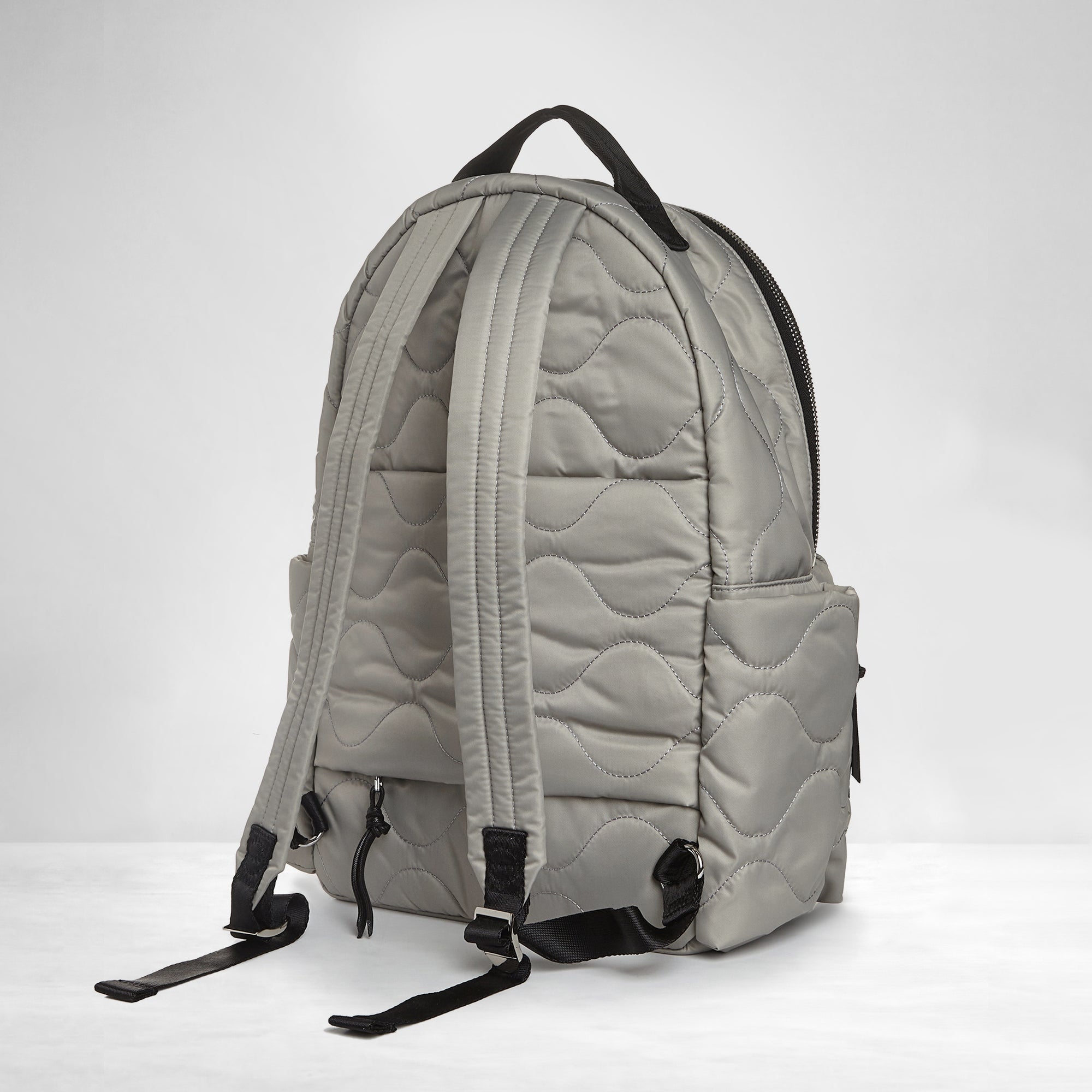 shortyLOVE tate backpack in milky grey; back view against white background.
