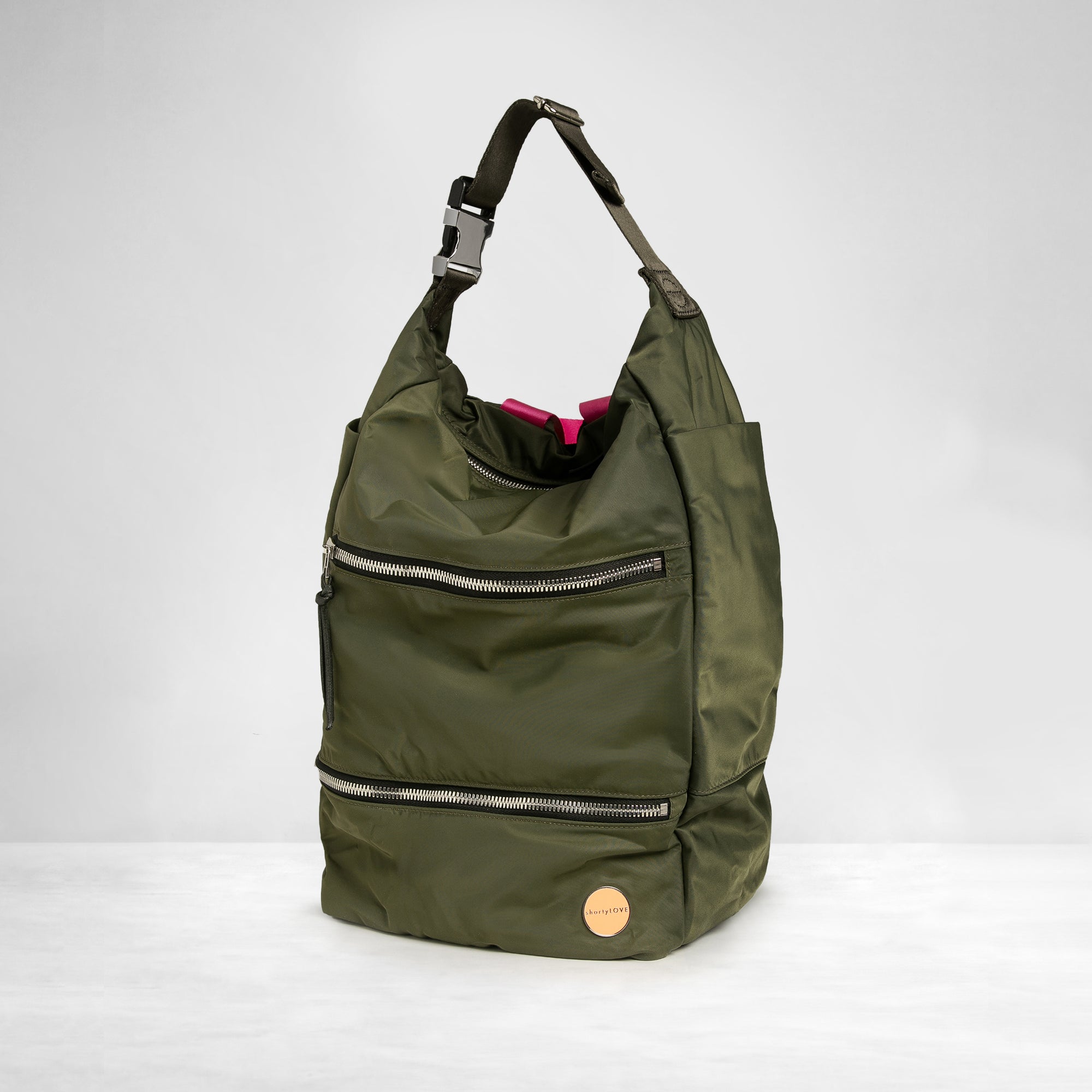 shortyLOVE boxer backpack bag in army green; side angle view against white background.