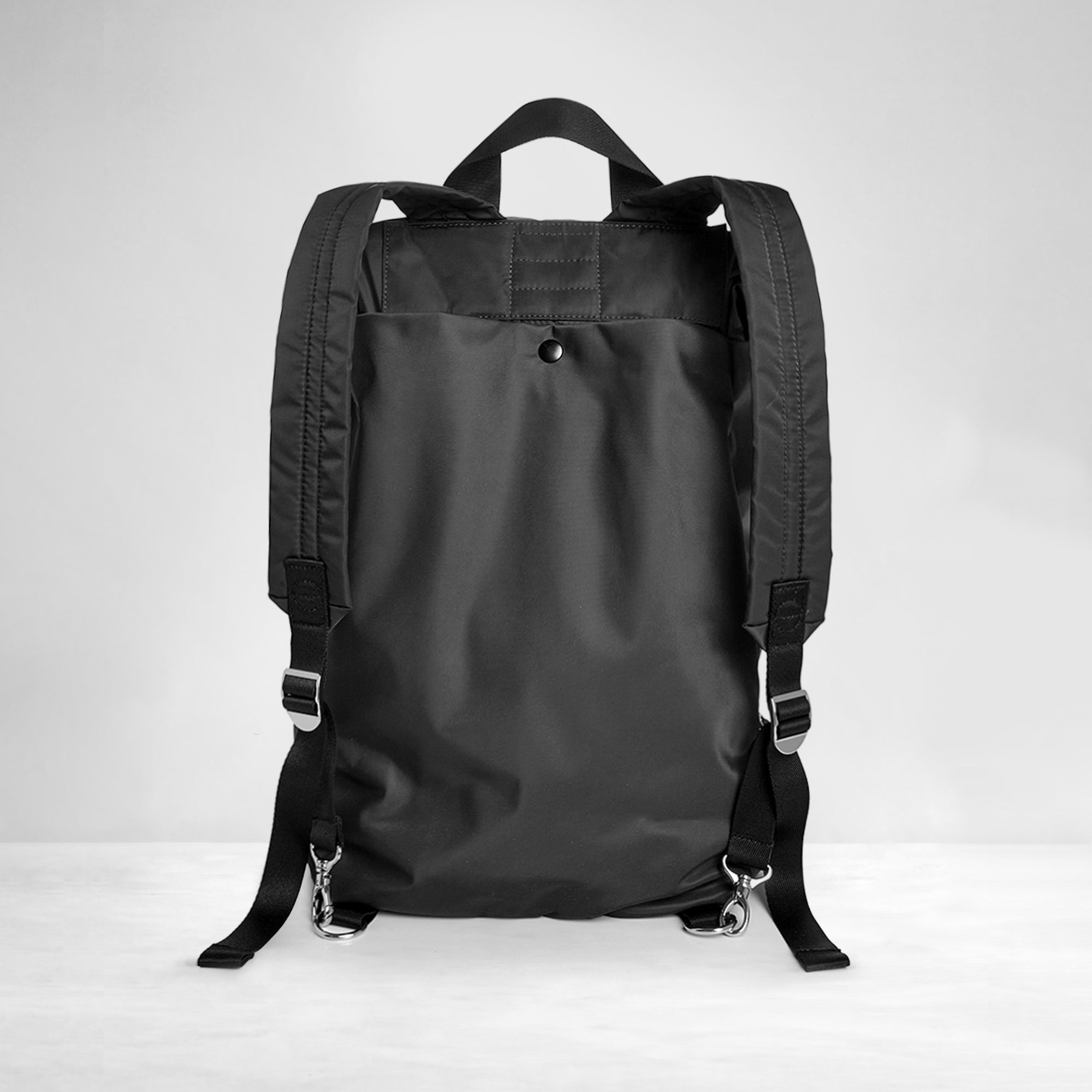 shortyLOVE boxer backpack bag in black; from the back against white background.
