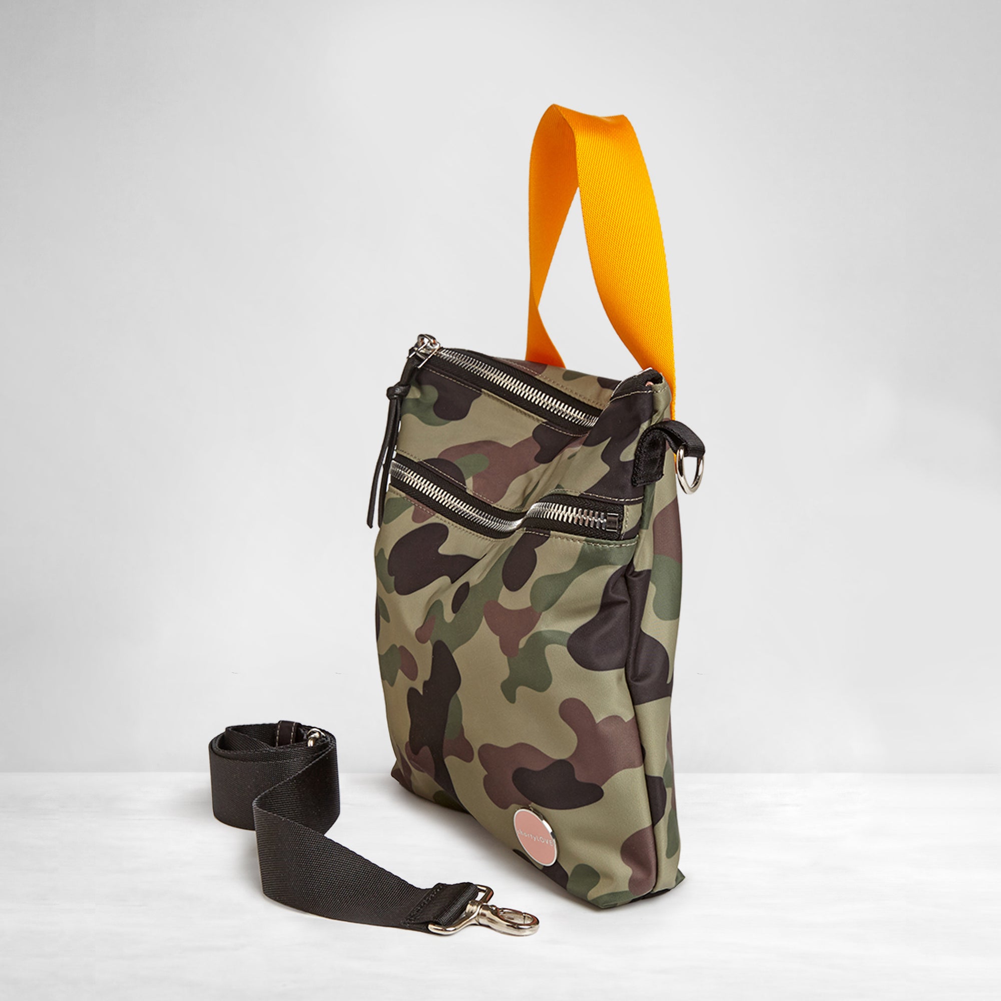 shortyLOVE amuse medium sized crossbody bag in green camo; side angle view against white background.