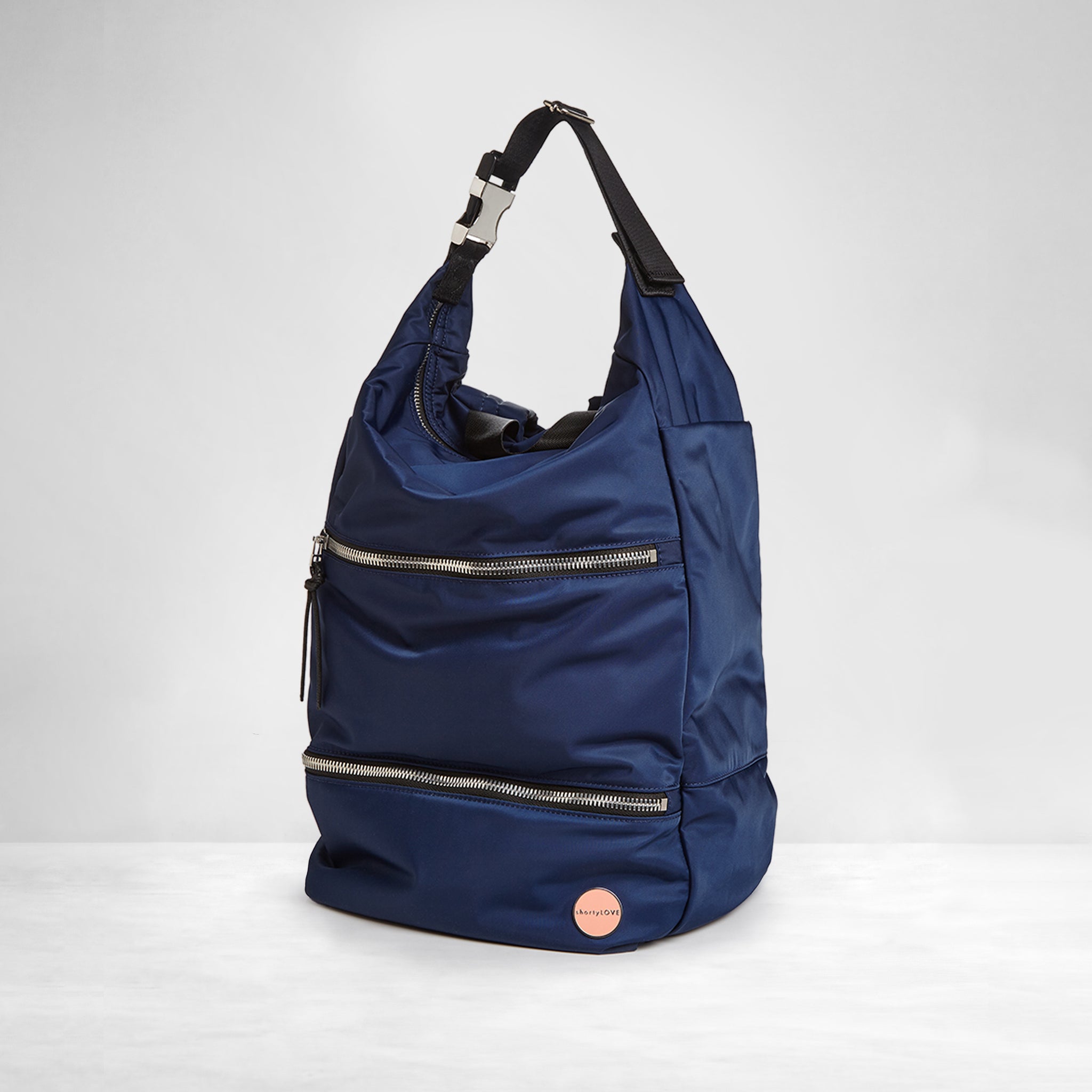 shortyLOVE boxer backpack bag in navy; side angle view against white background.