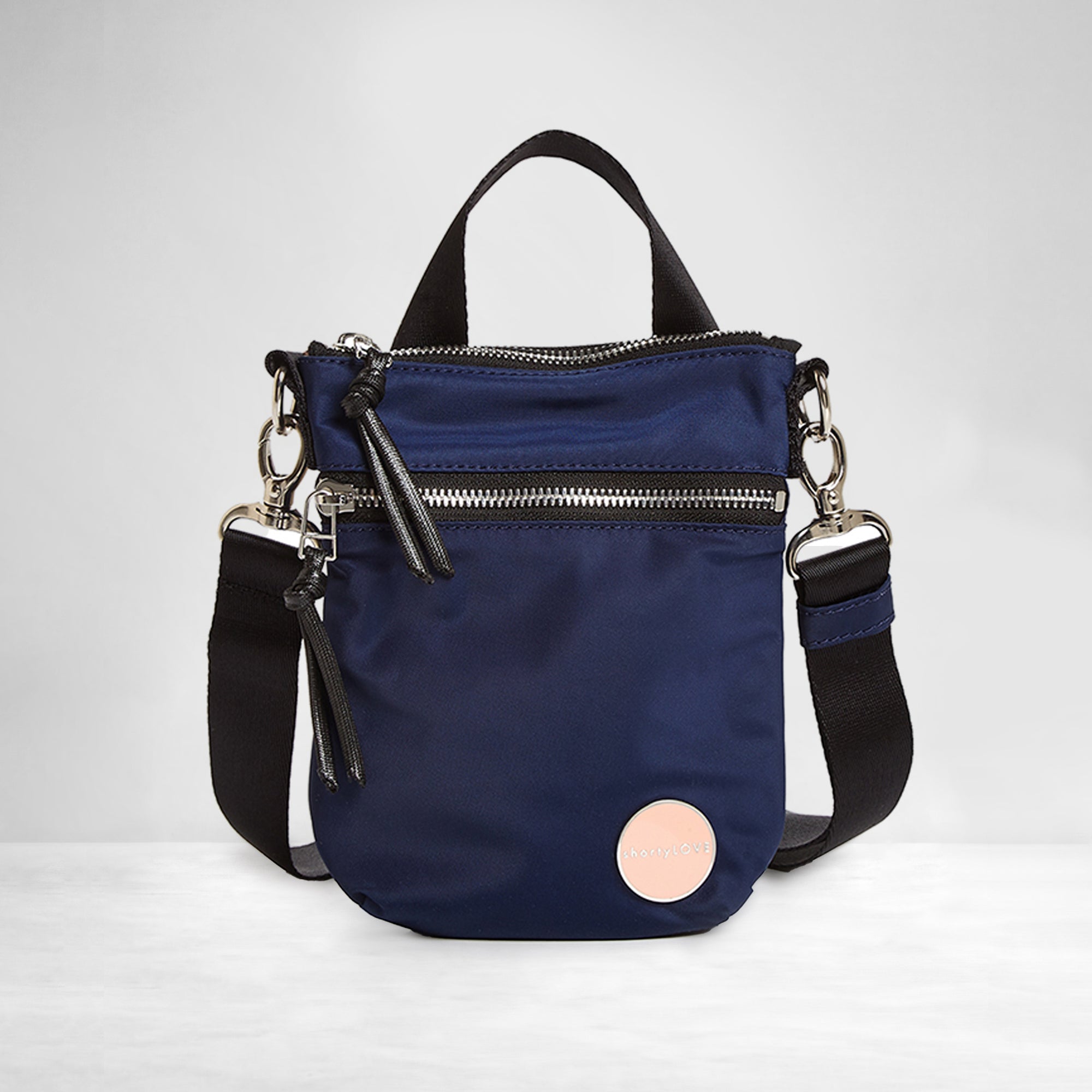 shortyLOVE shorthand crossbody phone bag in navy; front view against white background.