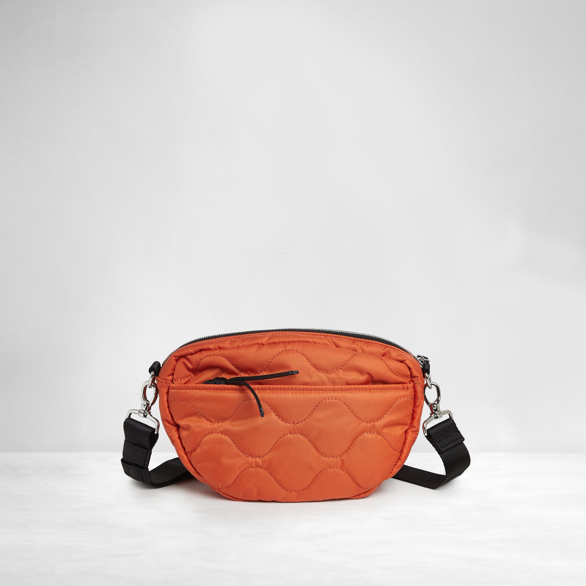 shortyLOVE small cruiser small crossbody bag in orange; back view against white background.