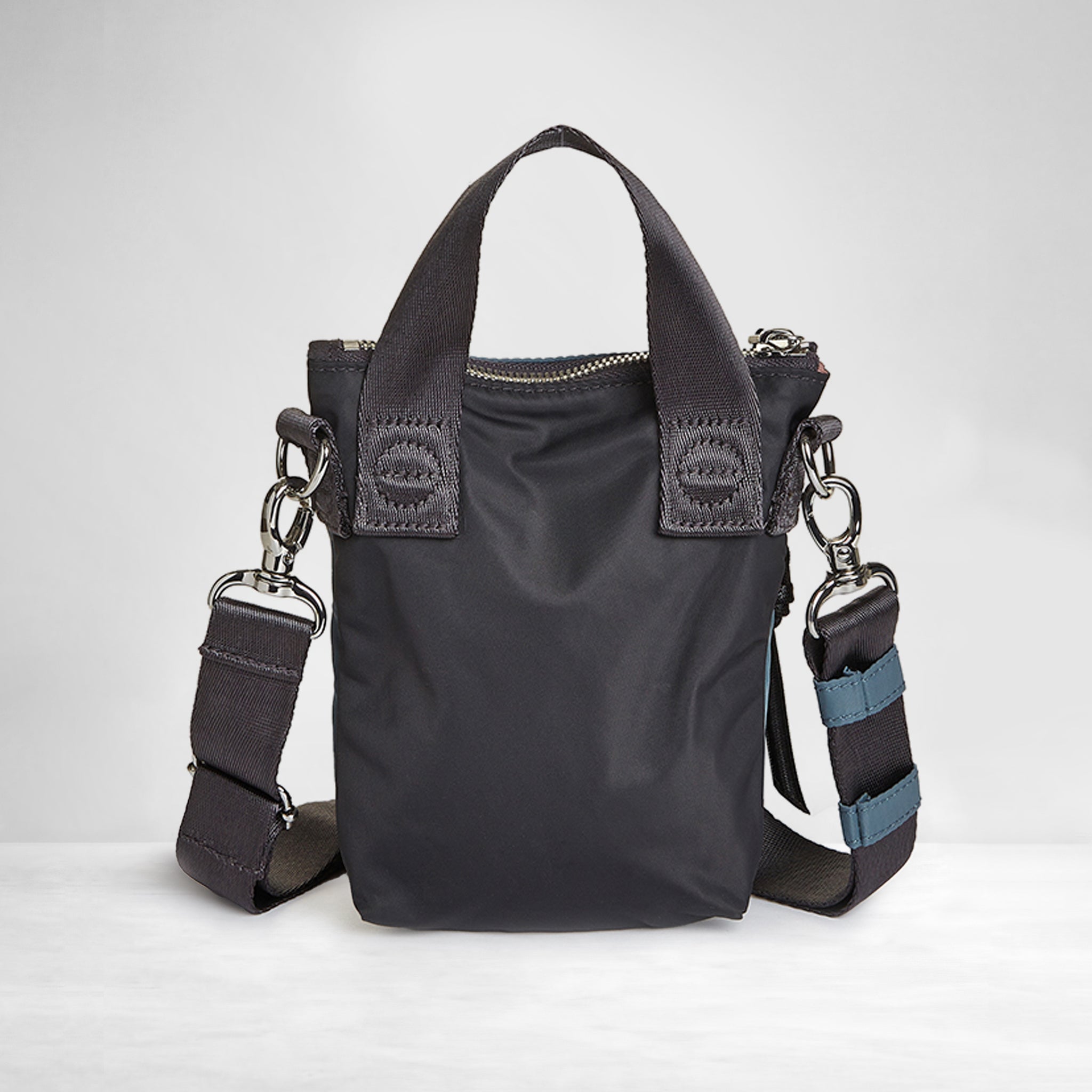 shortyLOVE shorthand small crossbody bag in steel blue/charcoal; back view against white background.