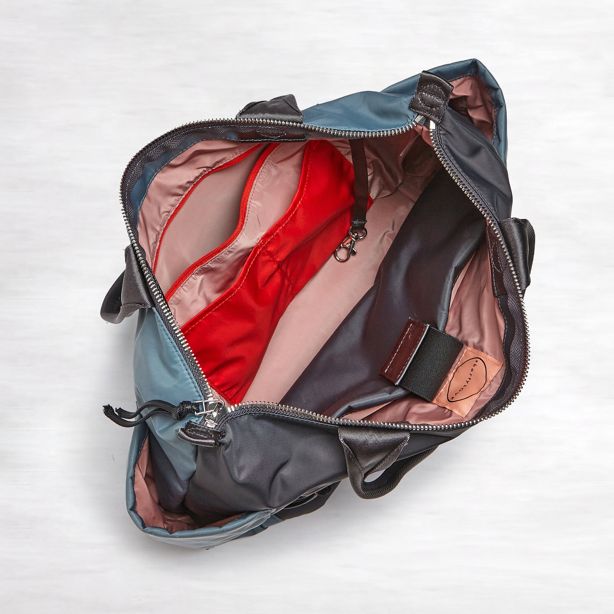 shortyLOVE tillie tote bag in steel blue/charcoal; top-down view showing interior steel blue/charcoal lining against white background.