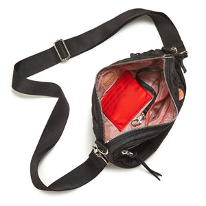shortyLOVE small cruiser small crossbody bag in black; top-down view showing interior blush lining against white background.