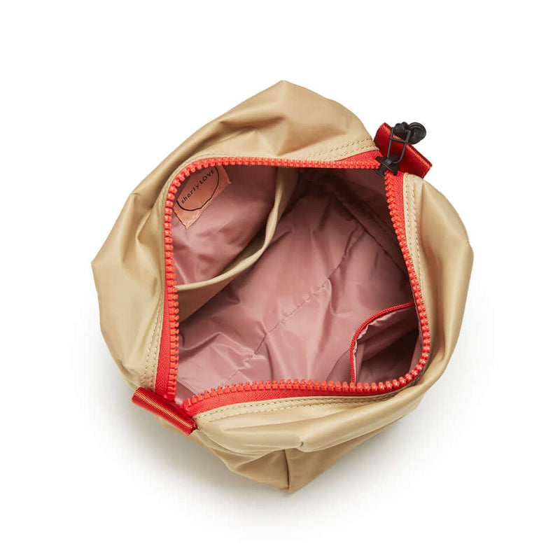 shortyLOVE stevie cosmetic bag in khaki; top-down view showing interior pink lining against white background.