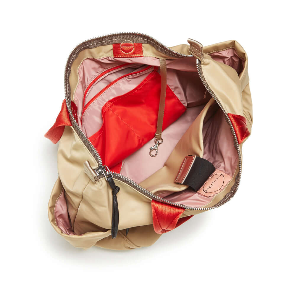 shortyLOVE tillie tote bag in khaki; top-down view showing interior pink lining against white background.
