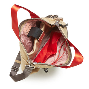 shortyLOVE wonder large crossbody/messenger bag in khak; top-down view showing interior blush/red lining against white background.

