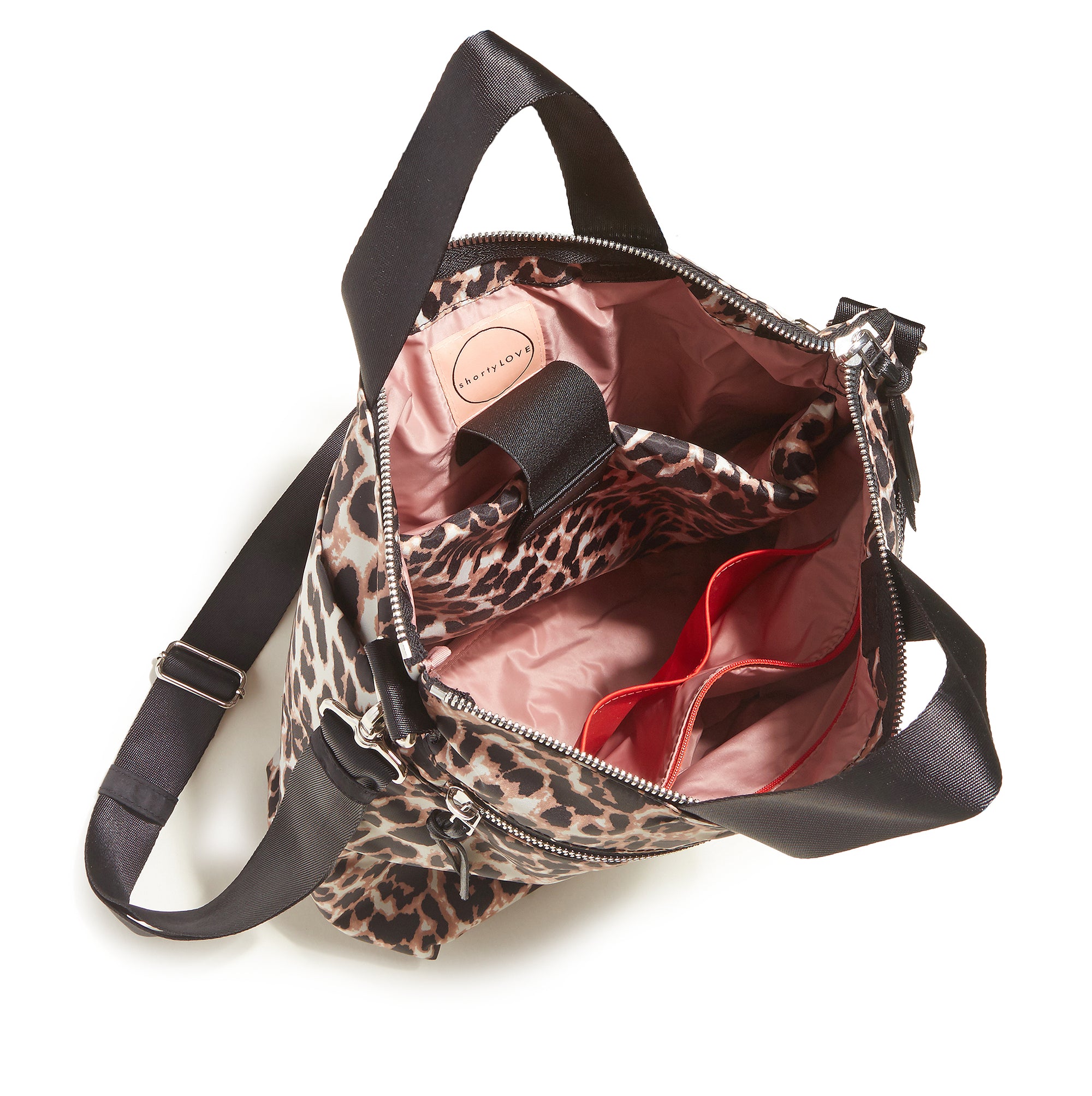 shortyLOVE wonder large crossbody/messenger bag in leopard; top-down view showing interior blush/red lining against white background.